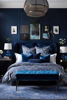 a bedroom with blue and white decor in the corner, along with pictures on the wall