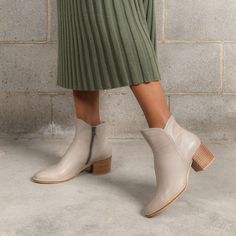 Step into effortless style with the Mockas Taupe Leather Ankle Boots by Django & Juliette. Crafted from soft and durable leather, these smart heeled boots feature a modern curved top and oval toe. With a medium-sized block heel for stability and a padded footbed for comfort, they're perfect for any occasion, day or night. Heeled Espadrilles, Mid Heel Boots, Patent Boots, Low Heel Boots, Metallic Sneakers, Taupe Leather, High Heel Boots Knee, Lace Up Flats, Low Heel Sandals