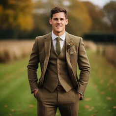 a man in a suit and tie posing for the camera