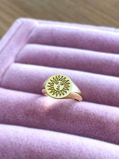 sun signet ring ♡ this beautifully engraved signet ring is a delicate piece of jewelry  to wear with any combination. the ring has solid back the face of the ring is 11 mm round materials: 10k gold 14k gold 14k rose gold 14k white gold 925 sterling silver 14k gold plated over silver 14k rose gold plated over silver gold/rose gold plated is genuine 925 sterling silver that has been expertly plated with a thick layer of 14k gold/rose gold size: we offer sizes from 3 to 13 1/2 for bigger size requests, please send a message ♡ important note about the ring size: ♡ to be able to make a ring which fits perfectly we kindly ask you to double check your finger size as shown in the picture in our gallery before placing your order shipping: ♡ all our listings include free expedited shipping delivers Sun Ring Gold, Monogram Ring Gold, Moon Rings, Engraved Signet Ring, Rings In Gold, Pinky Signet Ring, Sun And Moon Rings, Custom Signet Ring, Sun Ring