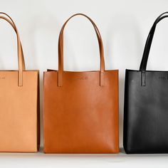 Tall market tote crafted in buttery soft and smooth vegetable tanned leather and an unlined interior. The sleek minimal design makes it a great everyday bag for work, school or a visit to the farmers market. It features reinforced bottom support and large interior pocket to keep your keys and phone close by. - Smooth Full Grain Italian Vegetable-Tanned leather - Unlined Interior - Includes 1 large interior pocket - Reinforced bottom support - Handcrafted in Italy in an ethical factory - Color: B Minimalist Leather Tote, Diy Leather Tote, Minimalist Tote, Slouchy Bag, Simple Tote, Leather Totes, Simple Leather, Market Tote, Leather Products