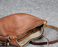 "This perfect size leather crossbody bag has two inner pockets, one which zips closed and one slip pocet for your phone. The satchel is made from soft italian leather, lined with cotton lining for secure. It's designed it to be classy and minimal to match with any outfit. * Made from genuine Italian leather. * Adjustable crossbody strap. * 2 inner pockets. * Size: H 8\" x W 11\" - 20x28 cm Caution. The leather may vary slightly depending on the piece used to manufacture. ← Back to the shop: http Everyday Crossbody Saddle Bag With Zipper, Leather Crossbody Shoulder Bag With Leather Lining, Crossbody Leather Shoulder Bag With Leather Lining, Everyday Leather Saddle Bag With Zipper Pocket, Leather Saddle Bag With Zipper Pocket For Everyday, Leather Lined Crossbody Hobo Bag For Daily Use, Everyday Leather Saddle Bag With Zipper, Daily Use Leather Saddle Bag With Zipper Pocket, Everyday Use Crossbody Shoulder Bag With Leather Lining