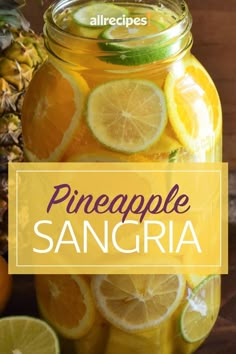 pineapple sangria in a mason jar with sliced lemons