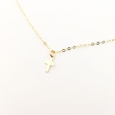 Experience serenity and elegance with our Serenity Dainty Cross Necklace. Crafted with a 16" 14k gold-filled or sterling silver chain and a delicate .5" cross pendant, this necklace adds a touch of sophistication to any outfit. Perfect for everyday wear or special occasions, it's a timeless accessory that will never go out of style. Embrace your faith with style. Dainty Cross Necklace With Delicate Chain For Everyday, Dainty Everyday Cross Necklace With Delicate Chain, Gift 14k Gold Filled Cross Pendant Charm Necklace, Everyday 14k Gold Filled Cross Pendant Necklace, 14k Gold Filled Cross Charm Necklace For Gift, 14k Gold Filled Cross Charm Necklace As Gift, Dainty Gold Sterling Silver Cross Necklace, Dainty Cross Necklace, Flat Heel Boots