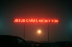 a neon sign that says jesus cares about you