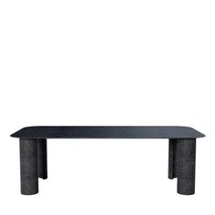 a black table sitting on top of a white wall