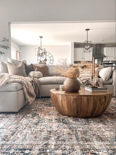 a living room filled with furniture and pillows