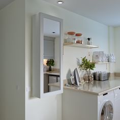 a washer and dryer in a small room