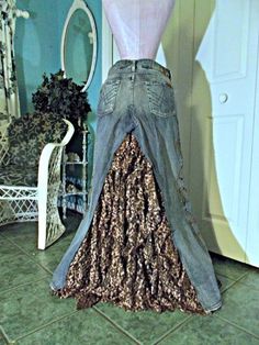 a mannequin is standing in front of a dress made out of jeans and sequins