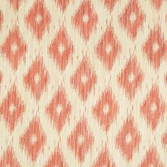 an orange and white pattern on fabric