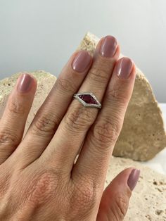 Item Details Model Number: SDL1210BWY Metal: Platinum 850 Weight: 4.1 grams Style: Art Deco Ring Size: 7 (contact us for sizing options) Main Stone Details Main Stone: Ruby Carat Weight: 0.90 CT Shape: Oval, French Cut Color/Clarity: Red/ Certificate: GGA All of our diamonds and gemstones are 100% natural! Other Diamond Details Carat Weight: 0.14 CT Shape: Round Color/Clarity: G/SI1 Cut: Very Good Formal Trillion Cut Ring With Halo Setting, Ruby Rings With Halo Setting And Marquise Cut, Ruby Rings With Marquise Cut In Halo Setting, Trillion Cut Halo Setting Ring For Formal Occasions, Trillion Cut Halo Ring For Formal Occasions, White Gold Ruby Ring With Accent Stones, Oval Shaped, Oval Diamond Cut Promise Rings, Classic Oval Ruby Ring With Diamond Cut, Oval Diamond Cut Ruby Ring