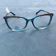 Bebe Aqua Crystal Eye Glasses Frames Bb5179 W/ Swarovski Crystals! Nwt! Bebe Uses State-Of-The-Art Materials To Craft Their Signature Eyewear Frames: Premium Cellulose Acetate, Ultra-Lightweight Titanium, And Color-Rich Stainless Steel. Frame Size: 52-17-140 The Length Of The Temple Pieces Are 140 Millimeters. The Width Of The Bridge Of This Frame Is 17 Millimeters And The Eye Size Is 52 Millimeters. Please Note: These Are For Frames Only! No Prescription In Lenses! Prescription Lenses Can Be Or Facial Accessories, Fancy Glasses, Glasses Collection, Glasses Fashion Women, Eye Glasses Frames, Four Eyes, Crystal Eye, Black Cat Eyes, Stylish Glasses