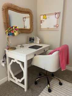 a white desk with a mirror and chair