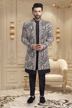 Introducing our Mens Sherwani, U2-S346. This open jacket style sherwani features intricate thread embroidery, adding a touch of elegance to any occasion. Elevate your style with our expertly crafted sherwani, perfect for formal events or special occasions. Designer Sherwani With Chikankari Embroidery And Long Sleeves, Designer Long Sleeve Sherwani With Chikankari Embroidery, Black Sherwani With Chikankari Embroidery, Black Chikankari Embroidered Sherwani, Black Chikankari Embroidery Sherwani, Designer Long Sleeve Sherwani For Eid, Elegant Outerwear With Chikankari Embroidery For Eid, Elegant Chikankari Embroidery Outerwear For Eid, Designer Sherwani With Intricate Embroidery For Winter