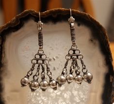 These Silver Tribal Earrings make a bold statement!  Boho tribal style, OOAK and fit for a goddess! The perfect fit for the adventurous! Earrings measure 2.75 inches in length. Traditional Dangle Chandelier Earrings, Unique Silver Chandelier Earrings With Dangling Beads, Traditional Long Drop Earrings For Pierced Ears, Traditional Long Drop Earrings With Dangling Beads, Sterling Silver Dangling Beads Earrings For Festival, Festival Sterling Silver Earrings With Dangling Beads, Festival Dangle Chandelier Earrings, Festival Oxidized Dangle Danglers, Oxidized Finish Dangle Earrings For Festival