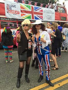 two women dressed up in union jack and british flag outfits at the london pride parade