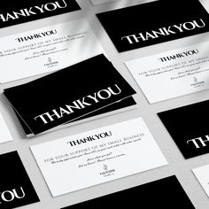 black and white business cards with the words thank you written on them are laid out next to each other