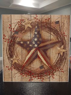 an american flag painted on top of a wooden star