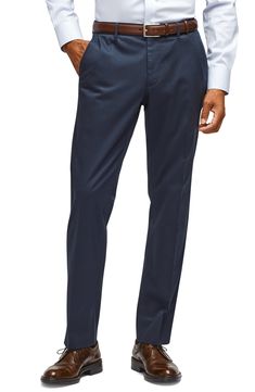 A sharp look for any day of the week, these flat-front pants are made from soft, easy-care stretch fabric and cut for a trim (but not tight) fit. 15" leg opening; 10" front rise; 14 1/2" back rise (size 32) Zip fly with hook-and-bar closure Front slant pockets; back button-welt pockets 97% cotton, 3% spandex Machine wash, tumble dry Imported Slim Fit Dress Pants, Stretch Dress Pants, Slim Fit Dress, Flat Front Pants, Monday Blues, Mens Dress Pants, Slim Fit Dresses, Day Of The Week, Fit Dress