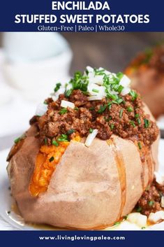 a close up of a baked potato on a plate