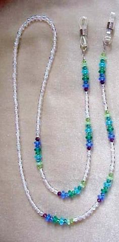 "This is an eyeglass chain that is elegant and has sea toned or jewtoned blues, greens and purple swarovski crystals with lovely matte czech glass beads in between with the main beads czech crystal ab round glass beads.it is approx 29\" long. it retails for $68 in gift shops and boutiques. it is strung on 49 strand nylon coated flexible and non kinking wire.if you would prefer to wear this as an eyeglass necklace, i can change the ends to a large loop for you to hang your glasses thru like a nec Eyeglass Jewelry, Eyeglass Chain Holders, Eyewear Chain, Eyeglass Necklace, Gift Shops, Eyeglass Chain, Czech Crystal, Glasses Chain, Crystal Ab