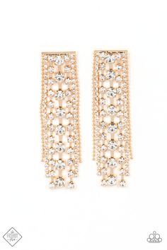 pair of gold tone earrings with crystal stones