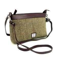 Our Harris Tweed Large Shoulder Bag is a brilliant size with a durable style, that can be used every day. The shoulder bag has one main compartment, secured with a zip. Inside this Harris Tweed bag there are open pockets for phones and essentials as well as a small zip compartment. This bag has a short shoulder strap as well as a longer detachable strap that you can wear across your body. Large Shoulder Bag Dimensions: 20cm x 30cm x 9cm The vegan leather trim colour will differ depending on the Beige Tweed Bags For Everyday Use, Classic Tweed Bags For Everyday, Classic Tweed Bag For Everyday Use, Brown Tweed Shoulder Bag For Everyday Use, Rectangular Tweed Shoulder Bag For Everyday, Tweed Top Handle Shoulder Bag For Everyday, Classic Tweed Bags For Everyday Use, Rectangular Tweed Shoulder Bag For Everyday Use, Tweed Satchel Bag For Everyday Use