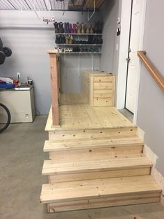 some stairs made out of wood in a garage