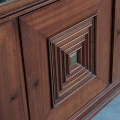 a close up view of a wooden cabinet door