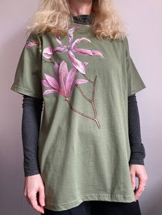 Flower art botanical shirt can be amazing Mom Birthday gift. Hand painted magnolia floral t shirt is my peace of art for aesthetic clothes. Custom flower shirt with white magnolia is gentle and exclusive. Botanical art magnolia painting also can be wonderful sweet sixteen or 21st birthday gift for her or 30th birthday gift for her.  ABOUT WHAT THIS T-SHIRT White magnolia is such a cute gentle spring flower. If you like it, then the magnolia pattern on the aesthetic denim dress will delight you e Hand Painted T Shirts Aesthetic, Oversized Floral Print T-shirt For Spring, Botanical Style Short Sleeve T-shirt With Floral Embroidery, Botanical Short Sleeve T-shirt With Floral Embroidery, Botanical Style T-shirt With Floral Embroidery, Oversized Cotton Floral Print Shirt, Spring Botanical Relaxed Fit Top, Botanical Style Relaxed Fit Spring Top, Relaxed Fit Botanical Tops For Spring