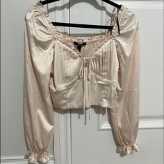 Nwt Forever 21 Medium Satin Ruffled Crop Top In Champagne Forever 21 Spring Ruffle Blouse, Spring Ruffle Blouse By Forever 21, Spring Ruffled Blouse By Forever 21, Forever 21 Feminine Ruffled Tops, Long Sleeve Ruffled Crop Top For Day Out, Chic Ruffled Blouse From Forever 21, Elegant Forever 21 Crop Top For Spring, Chic Ruffled Blouse By Forever 21, Nude Shorts