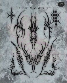 an artistic tattoo design is shown in black ink on a gray background with stars and swirls