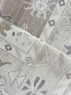 closeup of the pattern on an upholstered piece of fabric with different shapes and sizes