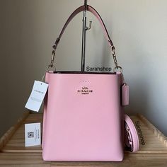 100% Authentic Brand New With Tags Cf433 Signature Interior Mollie Bucket 22 Powder Pink/Light Khaki And Gold Hardware Approximate Measurements: 8.5″ Bottom, 7.5” Top (L) X 8.5″ (H) X 4″ (W) Handle With 6" Drop Long Strap Included Bags Coach, Coach Purse, Powder Pink, Pink Light, Coach Purses, Coach Bags, Gold Hardware, Light Pink, Satchel