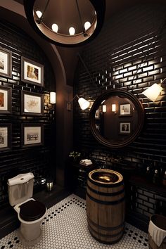 a bathroom with black and white tile flooring and wooden barrel sink, toilet and mirror