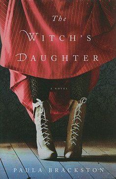 the witch's daughter book cover with boots and red cloth on top of it