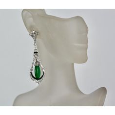 This is part of Chairish’s Fine Jewelry assortment.  Jade Enamel Diamond Long Earrings  These beautiful Jade Enamel Diamond long drop earrings consist of a teardrop Jade surrounded by Diamonds and green (same color as the Jade) Enamel. These earrings come from Spain and weight 16.2 grams. They are 5.3mm wide and 2 1/2" long. In beautiful condition. I love long drop earrings as I have long hair and when worn they show, but short haired women would like these as well because they make a bold state Pierced Teardrop Earrings For Evening, Clip-on Drop Jewelry For Evening, Elegant Green Teardrop Earrings For Anniversary, Evening Clip-on Drop Jewelry, Elegant Teardrop Chandelier Earrings For Evening, Green Teardrop Earrings For Formal Occasions, Green Drop Teardrop Earrings For Formal, Green Dangle Chandelier Earrings For Formal Occasions, Green Dangle Chandelier Earrings For Formal Events