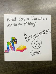 a sign that says, what does a librarian use to go fishing? a book worm and mom