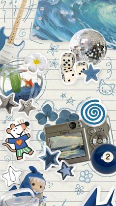 various stickers on lined paper with an image of a guitar and other items in the background