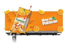 an advertisement for orange juice is shown on the side of a billboard that reads now in pakistan