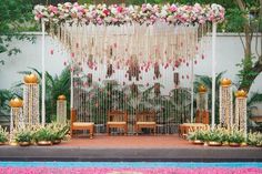 an outdoor wedding setup with flowers and greenery