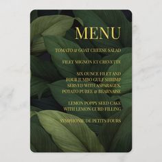 a menu card with green leaves and gold foil lettering on the front, along with instructions for how to use it