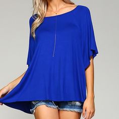 This Swing Tunic - In A Gorgeous, Universally-Flattering Cobalt Blue - Will Quickly Become A Favorite. Features Dolman Sleeves And The Perfect Swingy, Oversize Fit. Equally Fab With Jeans Or A Skirt, You'll Want This Baby In Every Color! Solid Cobalt Swing Tee. Dolman/Batwing Sleeves Hit At Elbow. Made In The Usa. 95% Rayon Jersey/5% Spandex. Boxy Cut, Though Still True To Size. If You Would Prefer A Slimmer Fit, Size Down One. Blue Solid Color Crew Neck Blouse, Summer Batwing Sleeve Tops, Casual Blue Blouse With Batwing Sleeves, Blue Batwing Sleeve Blouse For Spring, Blue Batwing Sleeve Blouse For Summer, Blue Summer Blouse With Batwing Sleeves, Casual Blue Tops With Batwing Sleeves, Casual Blue Batwing Sleeve Blouse, Blue Batwing Sleeve Summer Tops