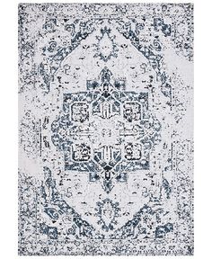 a blue and white rug with an ornate design on the bottom, in front of a white background