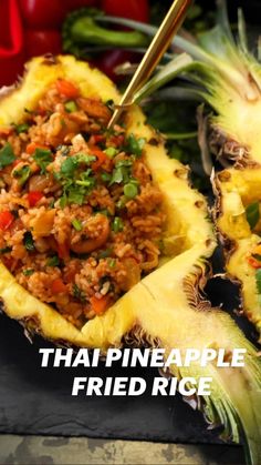 pineapple fried rice in a pineapple shell with chopsticks on the side