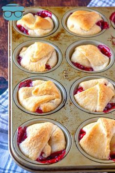 a muffin tin filled with mini strawberry pies