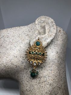 Vintage Indian wedding style button stud earrings Main stone Green emerald and white sapphire Over an inch long Lovely handmade silver work with gold finish 92.5% Sterling Silver All jewelry is shipped in a nice gift box. Check out our over a THOUSAND great reviews Festive Gold-plated Jeweled Earrings, Elegant Green Chandelier Earrings With Intricate Design, Elegant Green Crystal Earrings For Festive Occasions, Green Gold-plated Earrings With Intricate Design, Green Gold Plated Round Earrings, Green Round Gold-plated Earrings, Green Intricate Design Gold-plated Earrings, Green Gold-plated Round Earrings, Traditional Emerald Earrings For Festive Season