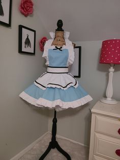 a dress made to look like a doll on a mannequin