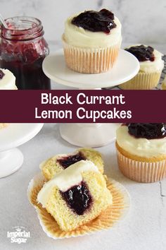 black curran lemon cupcakes with white frosting and blueberry jam on top