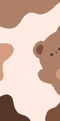 a brown and white teddy bear sitting on top of a cow skin textured background